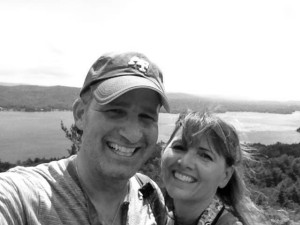 Mike and Helen in foreground standing above Fourth Lake in Lake George, NY in the background.